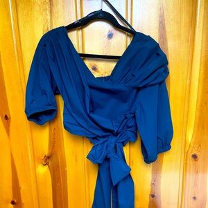 One side off the shoulder blouse.